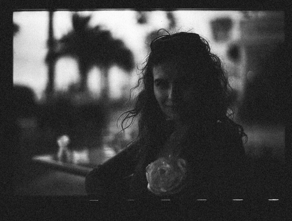 Grainy black-and-white portrait used as launch artwork